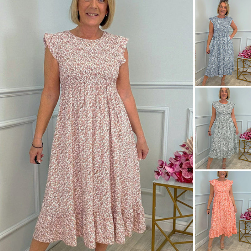 Elegáns női virágmintás ruha magas derekú és fodros ujjal.